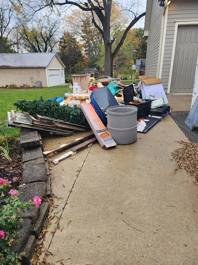 Dumpster being loaded with debris for Residential Dumpster Rental in Lowesville